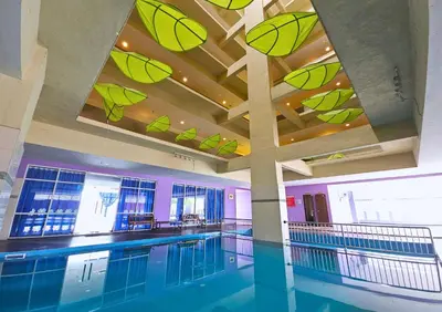 a swimming pool in a building with a ceiling at Hotel Taiping Perdana in Taiping