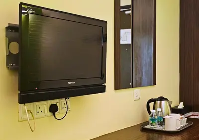 a flat screen tv hanging on a wall at Hotel Taiping Perdana in Taiping