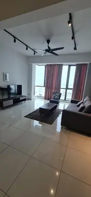 a large living room with a couch and a ceiling fan at Jazz Service Suites 2 bedroom 35-1 by Yen's Sojourn in Bagan Jermal