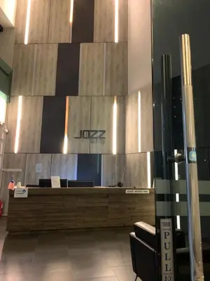 a lobby with a reception desk in a building at Jazz Service Suites 2 bedroom 35-1 by Yen's Sojourn in Bagan Jermal