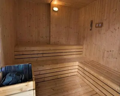 a wooden sauna with a wooden floor and a wooden at Jazz Service Suites 2 bedroom 35-1 by Yen's Sojourn in Bagan Jermal