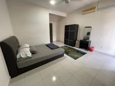 a living room with a couch and a mirror at De’ Nuhir Homestay Teluk Senangin in Kampong Batu Tiga