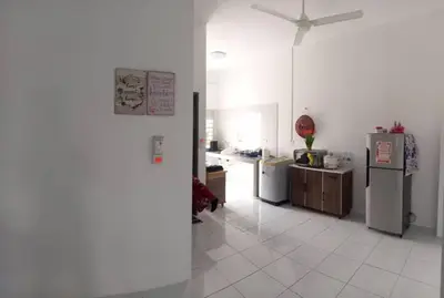 a kitchen with white tile floors and refrigerators at Homestay D'Mama Īfor mūslimĪ in Tanjung Malim