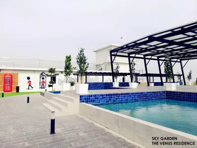 a swimming pool with a pavilion next to a building at Venus Hollywood Homestay Sitiawan in Seri Manjung