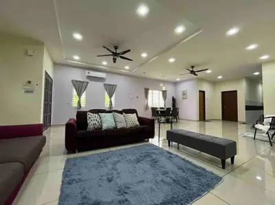 a living room with a couch and a table at Titihouse Semi-D for 14 pax near Iconvcity Auto city Bukit Mertajam Juru in Bukit Mertajam