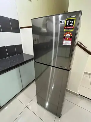 a stainless steel refrigerator sitting in a kitchen at Titihouse Semi-D for 14 pax near Iconvcity Auto city Bukit Mertajam Juru in Bukit Mertajam