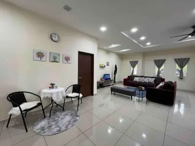 a living room with a couch and a table and chairs at Titihouse Semi-D for 14 pax near Iconvcity Auto city Bukit Mertajam Juru in Bukit Mertajam