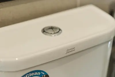 a close up of a button on the top of a toilet at The Palm, 2BR Cityview by WStay @ Tropicana 218 Macalister in George Town