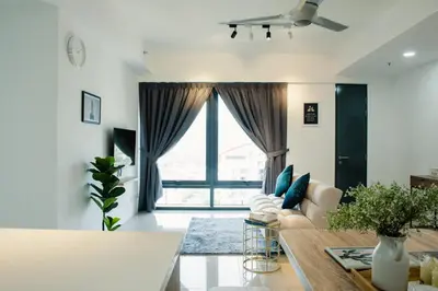 a living room with a couch and a table at The Aspen, 3BR Cityview by WStay @Tropicana 218 Macalister in George Town