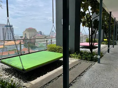 a swing on the roof of a building at The Aspen, 3BR Cityview by WStay @Tropicana 218 Macalister in George Town