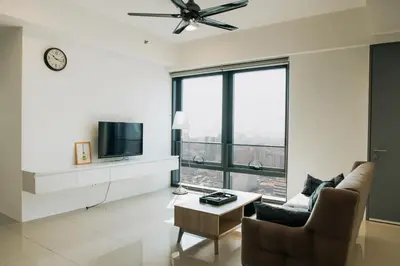 a living room with a tv and a couch and a table at The Pine, 3BR Seaview by WStay @ Tropicana 218 Macalister in George Town