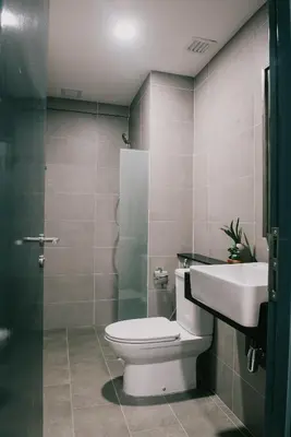 a bathroom with a toilet and a sink at Timeless, 3BR Cityview by WStay @ Tropicana 218 Macalister in George Town