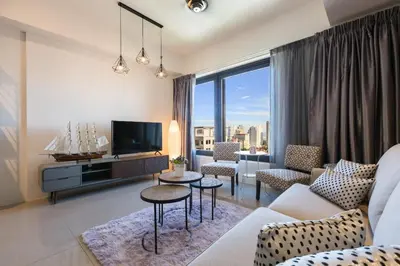 a living room with a couch and a tv at The Ash, 3BR Seaview by WStay @ Tropicana 218 Macalister in George Town