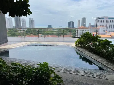 a large pool of water with a city in the background at The Ash, 3BR Seaview by WStay @ Tropicana 218 Macalister in George Town