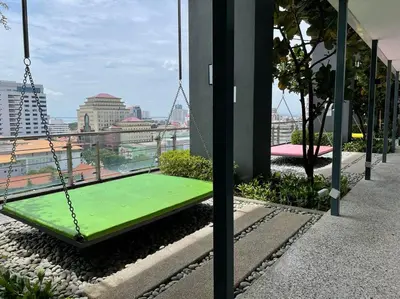 a swing on the roof of a building at The Ash, 3BR Seaview by WStay @ Tropicana 218 Macalister in George Town