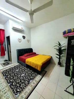 a bedroom with a bed in a room with a ceiling at LH Alisha Homestay Wangsa Mewangi Gua Musang in Gua Musang