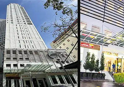a tall white building next to a building at Mansion One Entire House 4 QueenBeds - Spacious Balcony Seaview in George Town