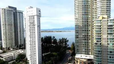 a view of a city with tall buildings and the ocean at Mansion One Entire House 4 QueenBeds - Spacious Balcony Seaview in George Town
