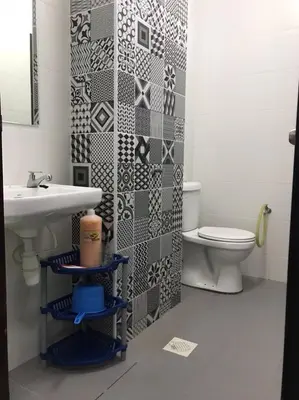 a bathroom with a sink and a toilet at MMG D'Bertam Homestay For Malay Only in Kampong Permatang Durian