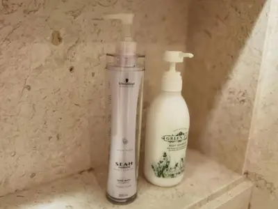 two bottles of soap are sitting on a counter at WHITE HOUSE STRAITS QUAY MARINA LUXURY STAY GURNEY in Tanjong Tokong