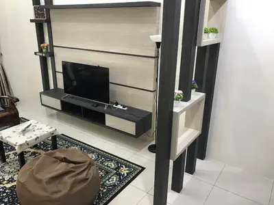 a living room with a flat screen tv on a wall at Koolest homestays Meru in Ipoh