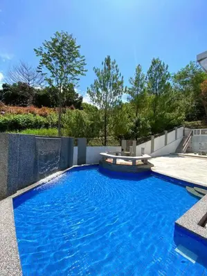 a large blue swimming pool in a yard at 25PAX 5BR Villa Kids Swimming pool, KTV, BBQ near SPICE Arena Penang 9800 SQFT in Bayan Lepas