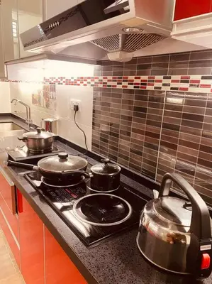 a kitchen with pots and pans on a stove at 25PAX 5BR Villa Kids Swimming pool, KTV, BBQ near SPICE Arena Penang 9800 SQFT in Bayan Lepas