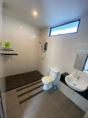a bathroom with a toilet and a sink at 25PAX 5BR Villa Kids Swimming pool, KTV, BBQ near SPICE Arena Penang 9800 SQFT in Bayan Lepas