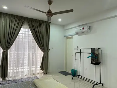 a bedroom with a ceiling fan and a window at D’sayang homestay klebang ipoh in Ipoh