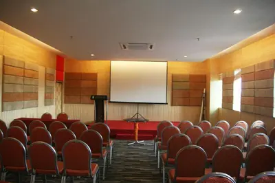 a lecture room with chairs and a projection screen at Ritz Garden Hotel Manjung in Lumut