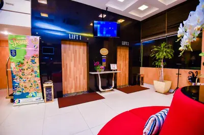 a lobby with a waiting room with avertisement at Ritz Garden Hotel Manjung in Lumut