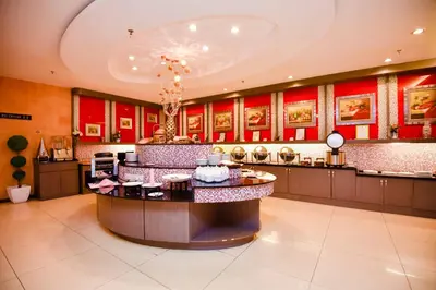 a large kitchen with a large island in a room at Ritz Garden Hotel Manjung in Lumut
