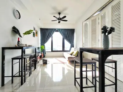 a living room with black bar stools and a ceiling fan at New Georgetown Tropical Macalister 218 Homestay 9pax to11pax HENG in George Town