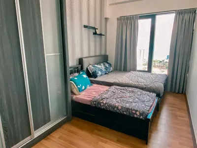 a small room with two beds and a window at New Georgetown Tropical Macalister 218 Homestay 9pax to11pax HENG in George Town