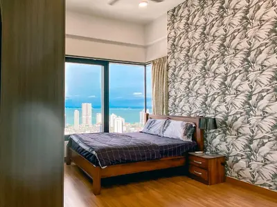a bedroom with a bed with a large window at New Georgetown Tropical Macalister 218 Homestay 9pax to11pax HENG in George Town