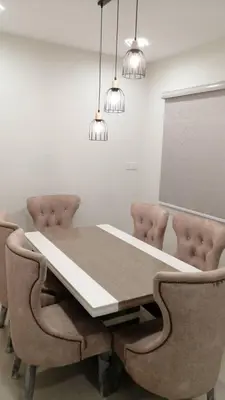 a dining room with a table and two chairs at Rumah Hana Sungai Besar - Mslim0nly in Sungai Besar