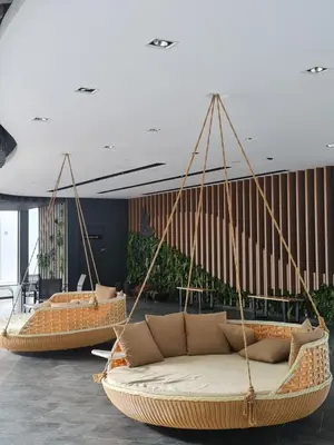 a room with three hanging chairs and a couch at The Cove Hillside Condominium in Ipoh