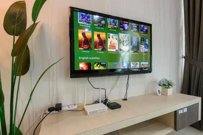 a flat screen tv sitting on a wall at 2R1B/Seaview Tropical /1~8Pax/Gurney Mansion One in George Town