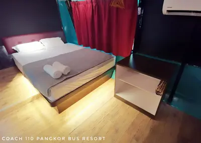 a bedroom with a bed with two towels on it at Pangkor Bus Resort by BESLA in Pangkor