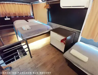 a small room with two beds and a couch at Pangkor Bus Resort by BESLA in Pangkor