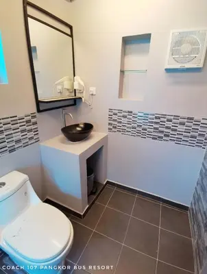 a bathroom with a sink and a toilet at Pangkor Bus Resort by BESLA in Pangkor
