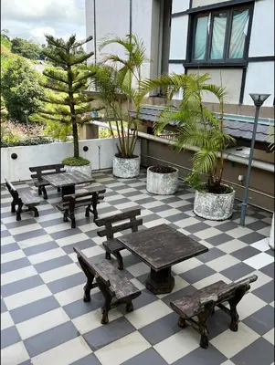 a group of picnic tables on a checkered floor at NEW 6pax 3BR Sunrise view 100m Attractive Places Kea Farm in Cameron Highlands