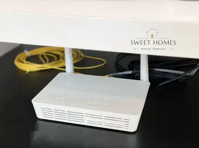 a white router sitting on top of a table at Pool View Stylish Suite at Jelutong Penang 1-4pax in George Town
