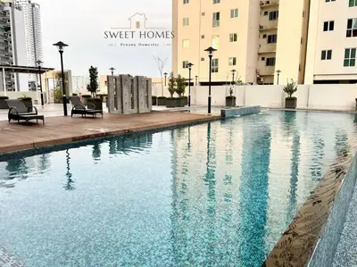 a swimming pool in the middle of a building at Pool View Stylish Suite at Jelutong Penang 1-4pax in George Town