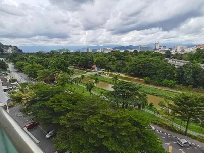 a view of a park with trees and a street at Ipoh Town Kinta Riverfront Apartment 7pax by Glamorous in Ipoh
