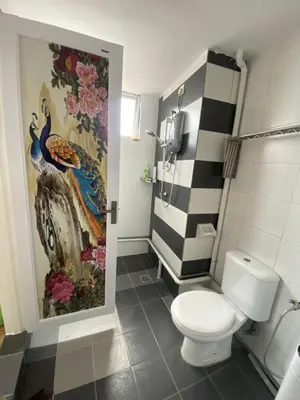 a bathroom with a toilet and a painting on the wall at 6PAX 1 BEDROOM SOHO Near USM SPICE ARENA PANTAI SPECIALIST AIRPORT in Bayan Lepas