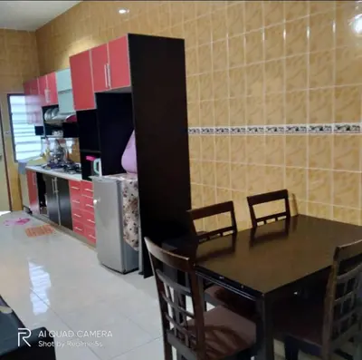 a kitchen with a table and chairs and a refrigerator at Zulkifli Homestay Tambun,Ulu kinta,Tg Rambutan in Ipoh