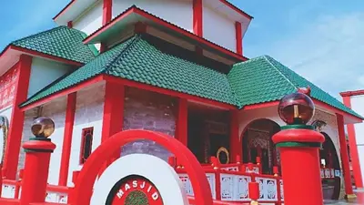 a red and white building with a green roof at Pangkor Pasir Bogak Apartment 2Rooms 2Bathrooms near beach 6pax FREE WIFI in Pangkor