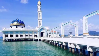 a mosque on the water next to a pier at Pangkor Pasir Bogak Apartment 2Rooms 2Bathrooms near beach 6pax FREE WIFI in Pangkor