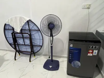 a fan sitting next to a trash can next to a fan at LOW SEASON PROMOTION! 4B12B Mountainville Bungalow in Ipoh